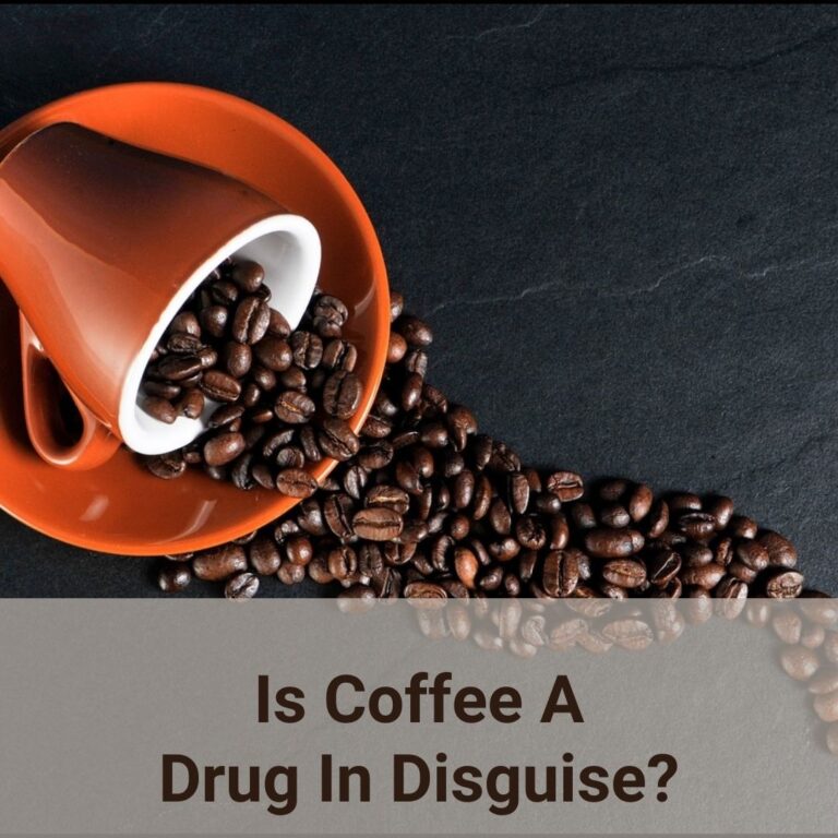 In this photo, it shows that an orange brownish coffee cup and matching saucer lie on a dark stone slate table top. Roasted coffee beans spill out of the cup which is lying on its side in the saucer.