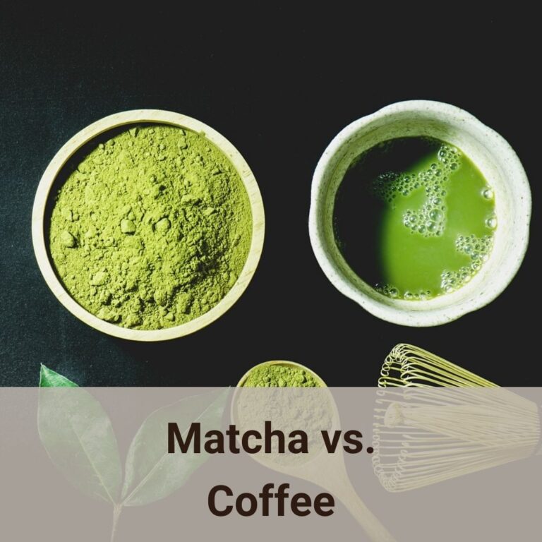 This is a very artistic photo shot that being shot from above. On a dark surface, there are two small round containers. On the left is a bamboo cup which has green matcha power in it. Next to it, on the right, it is a tea cup with wiskered matcha in it. Blow the two cups, from left to right, there are two fresh tea leaves, a bamboo table spoon with spoonful matcha power, a bamboo matcha wisker. Matcha vs. Coffee, which one should you drink?